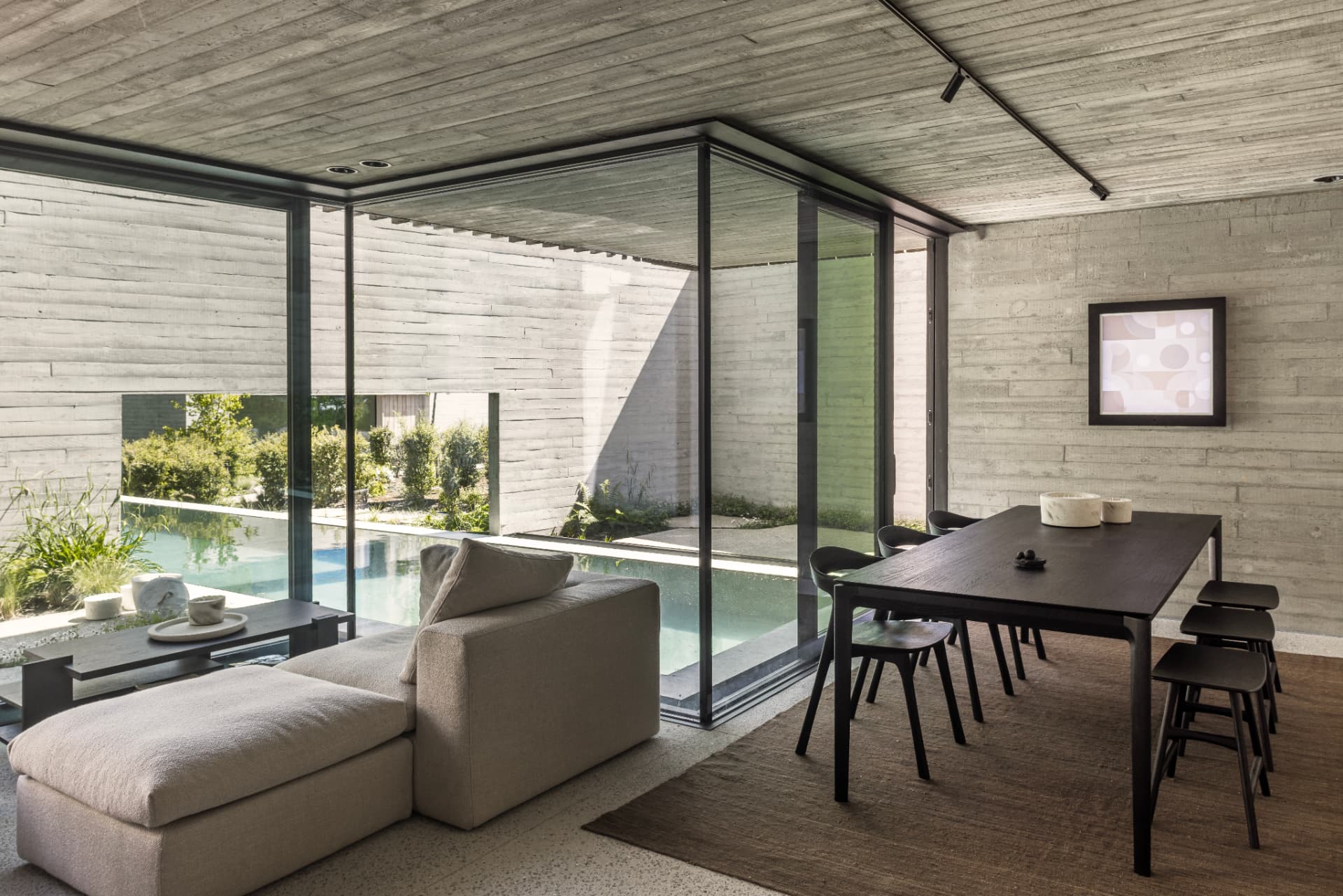 Light-filled OXfield living room beside the pool
