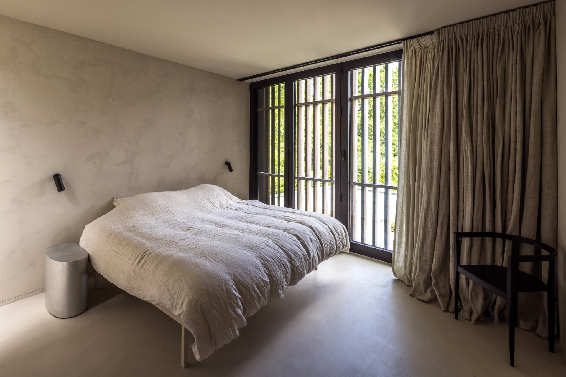 Minimal bedroom with dark timber screening at OXfield