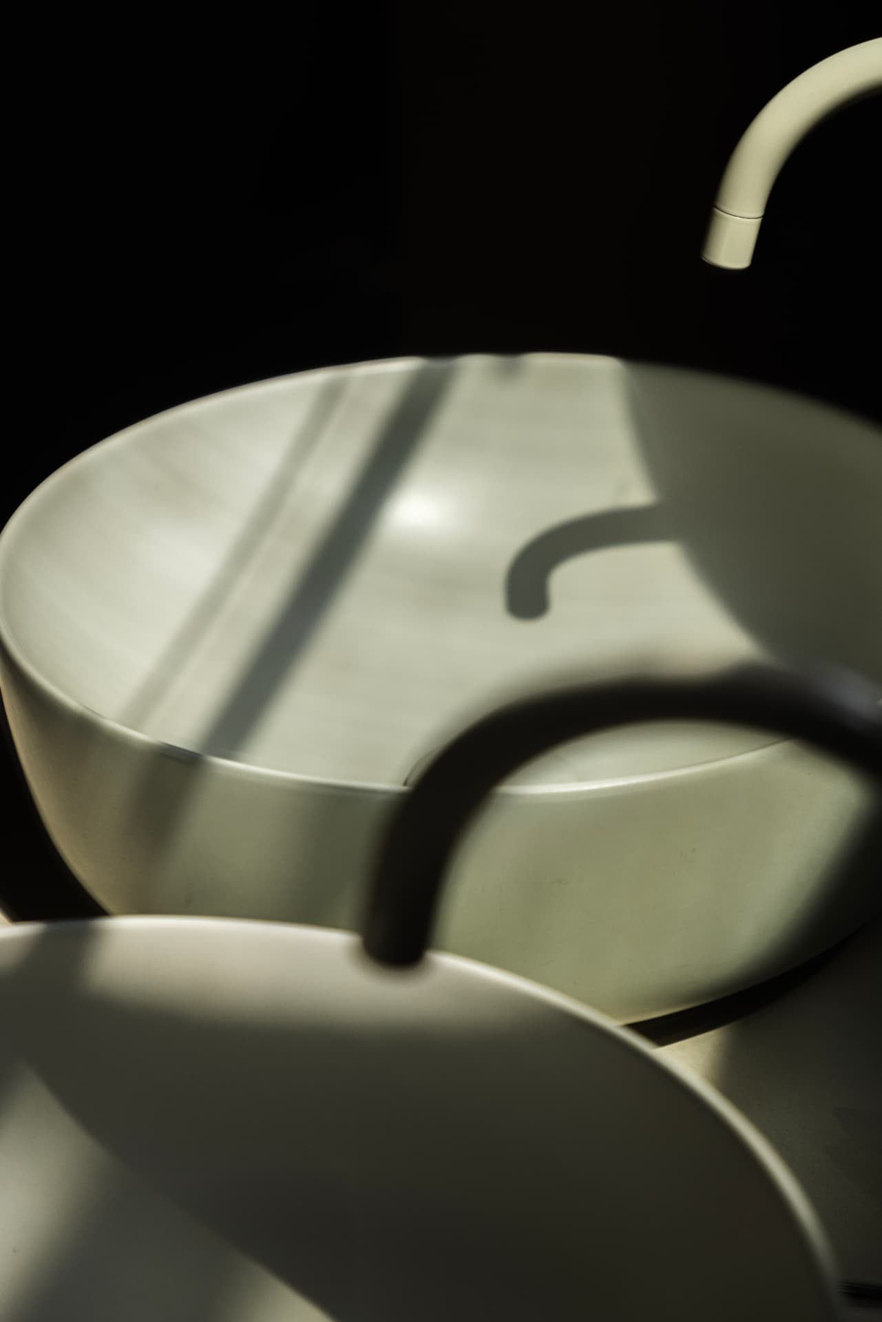 Sculptural basin and faucet detail at OXfield