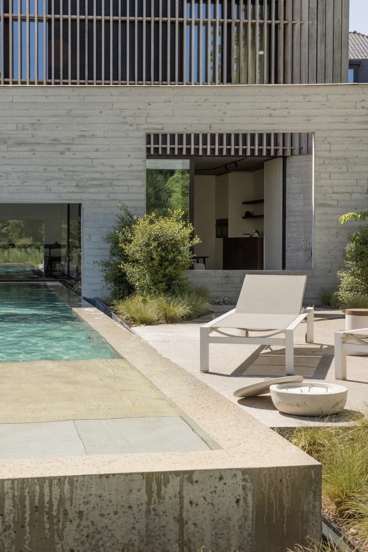 Pool terrace with fire bowl at dusk, OXfield