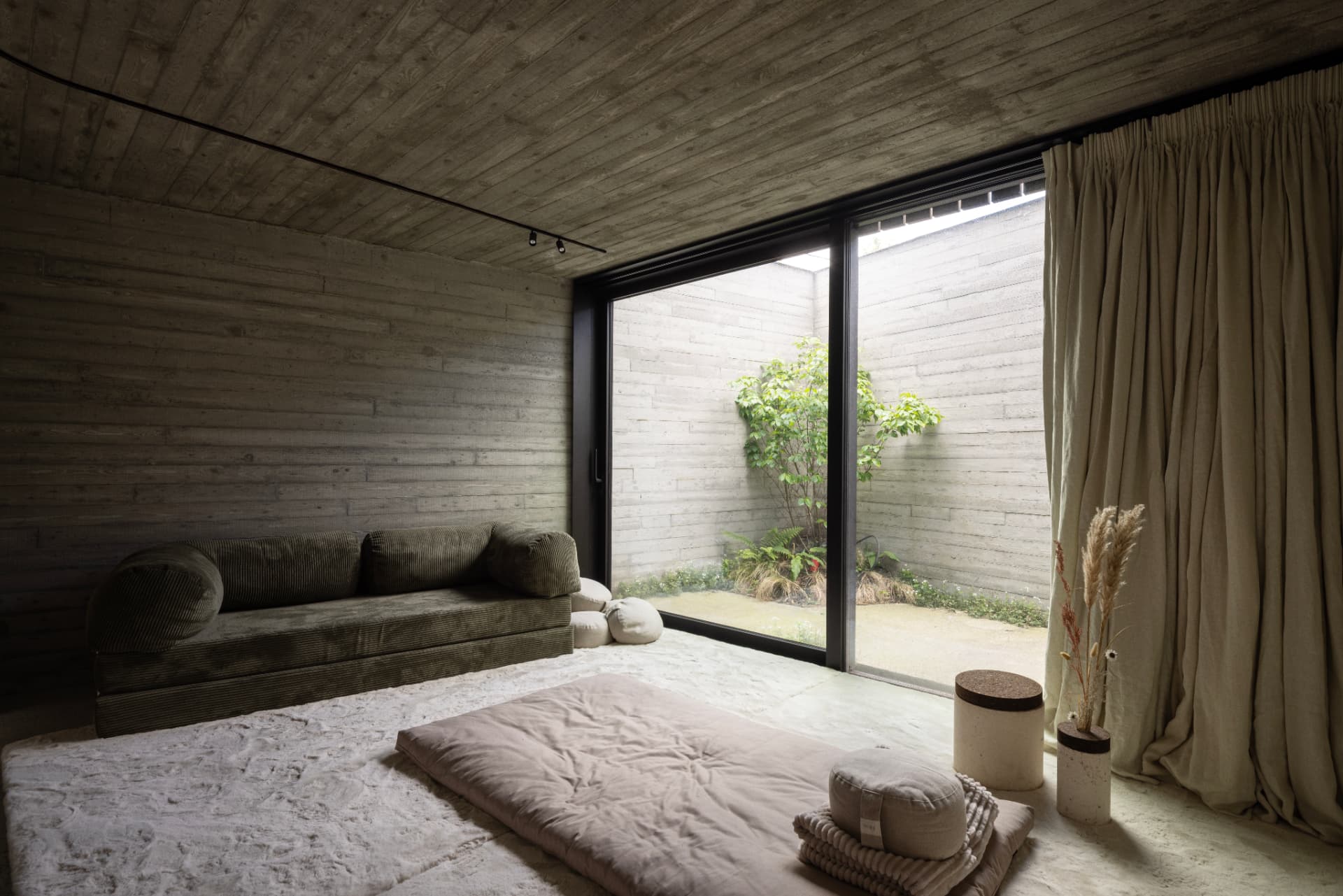 Dark, intimate OXfield bedroom in warm evening light